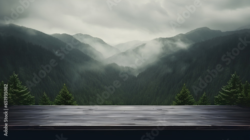 Empty black wooden table against misty in the forest of mountains. 