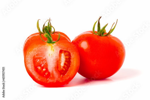 tomatoes fresh ripe cut in half to reveal the juicy flesh and seeds. isolated on a white background.