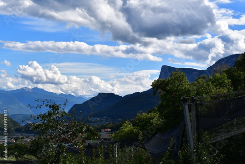 Schöne Landschaft mit Obstgärten und Bergen bei Tisens in Südtirol  photo