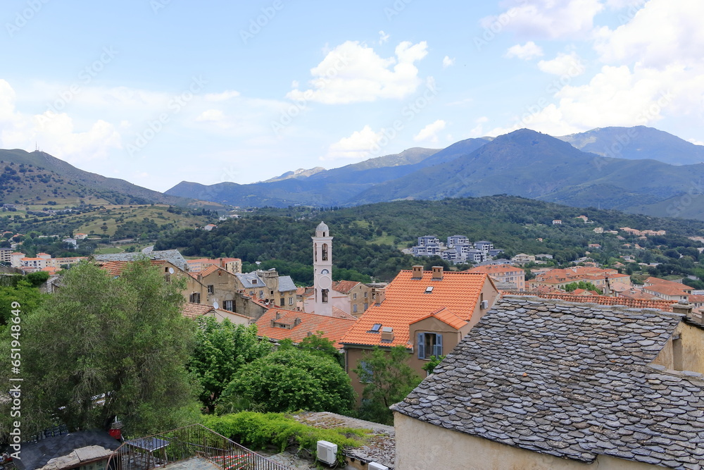 View over Corte city in Corsica surrounded by mountains, France