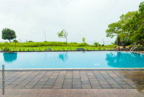 Beautiful blue clean swimming pool of a tourist hotel. Background for tourism  advertising and design. August 15  2023  Sooriya Resort Spa  Sri Lanka