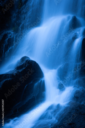 A waterfall tumbles over the rocks near Valdez, Alaska, USA. 