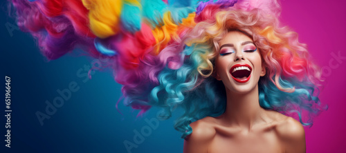 Funky playful young woman with long colorful hair. Beauty fashion banner © LiliGraphie