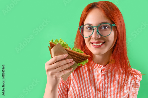 Young redhead woman with ta...