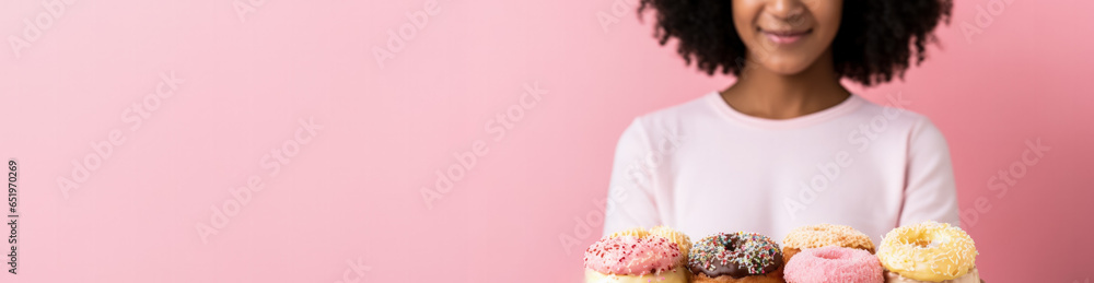 Artist savouring donut in creative studio background with empty space for text Artist savouring donut in creative studio background with empty space for text