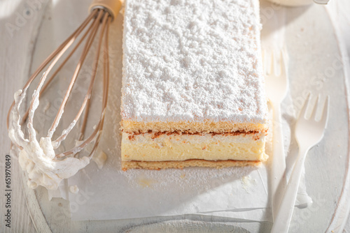 Sweet napoleon cake filling with custard cream. photo