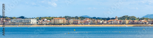 Saint-Jean-de-Luz and its Grande Plage beach on a sunny day in France photo