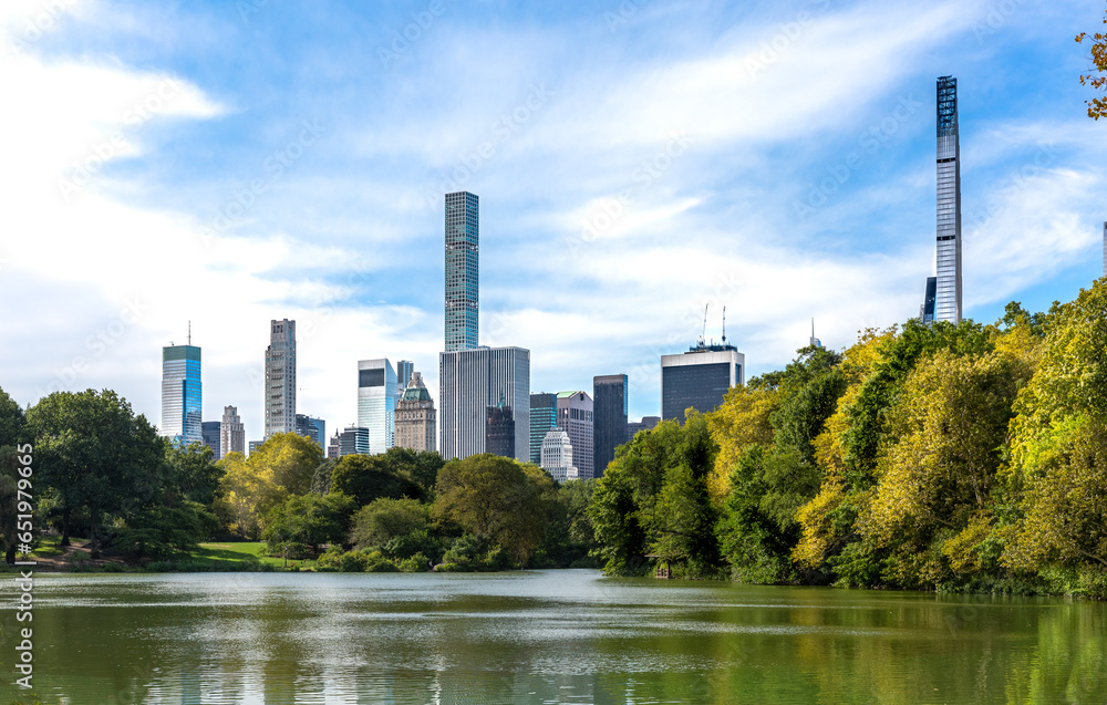Midtown Manhattan skyscrapers with a view from The Lake at Central Park in NYC Midtown Manhattan skyscrapers with a view from The Lake at Central Park in NYC