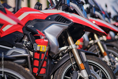 Close up of firemans motorcycles parked in the parking lot.