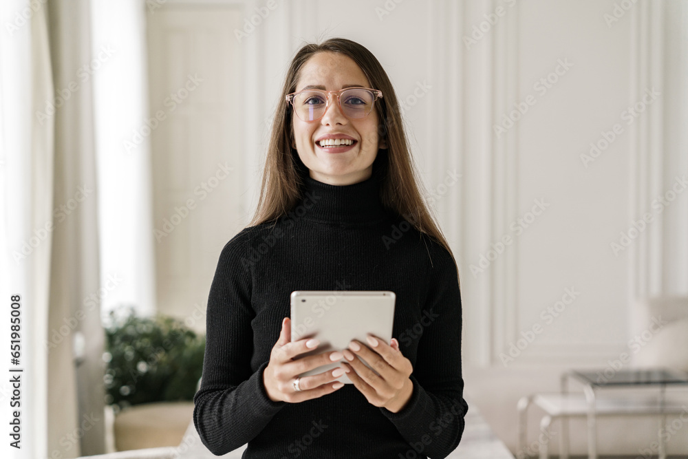 Female programmer young specialty application tester. The employee works for a company that consults clients. Freelancer in office clothes in a coworking space. Female programmer young specialty application tester. The employee works for a company that consults clients. Freelancer in office clothes in a coworking space.