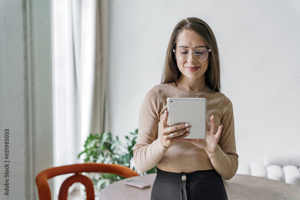 The employee works for a company that consults clients. Freelancer in office clothes in a coworking space. Female programmer is a young specialist application tester. The employee works for a company that consults clients. Freelancer in office clothes in a coworking space. Female programmer is a young specialist application tester.