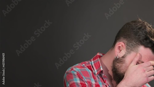 Young bearded man showing dissappointment photo