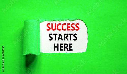 Success starts here symbol. Concept word Success starts here on beautiful white paper. Beautiful green table green background. Business motivational success starts here concept. Copy space.