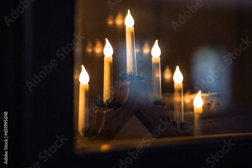 winter holidays and celebration concept - close up of advent candlestick on w...