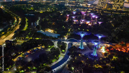 Fototapeta Naklejka Na Ścianę i Meble -  Singapore and Marina Bay skyscrapers. Aerial view at night from drone