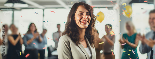 Woman Celebrating Her Promotion With Colleagues At The Office Panoramic Banner photo