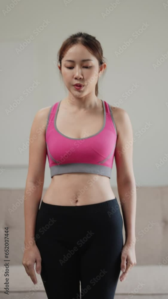 athlete asian woman doing warming up exercise at home. athlete asian woman doing warming up exercise at home.
