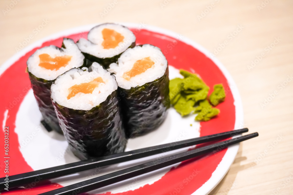 Various sushi platter in square ceramic plate on Japanese Restaurant. Concept for whole healthy food, nutrition, omega-3, animal protein, seafood, modern resto and street food. Various sushi platter in square ceramic plate on Japanese Restaurant. Concept for whole healthy food, nutrition, omega-3, animal protein, seafood, modern resto and street food.