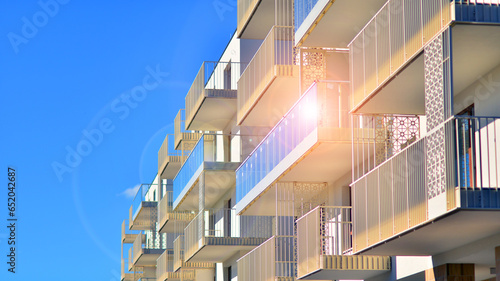 Modern luxury residential building. Modern apartment building on a sunny day. Facade apartment building with a blue sky. 