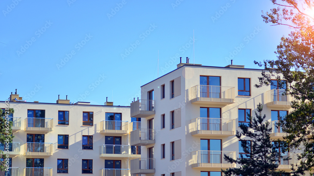 Modern luxury residential building. Modern apartment building on a sunny day. Facade apartment building  with a blue sky. 