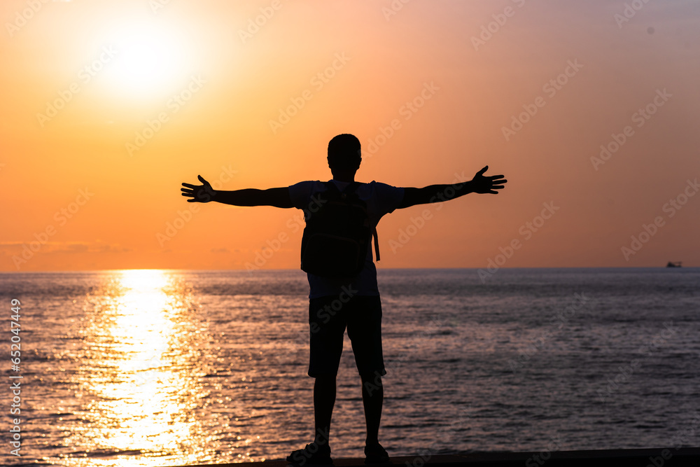 man standing on the beach