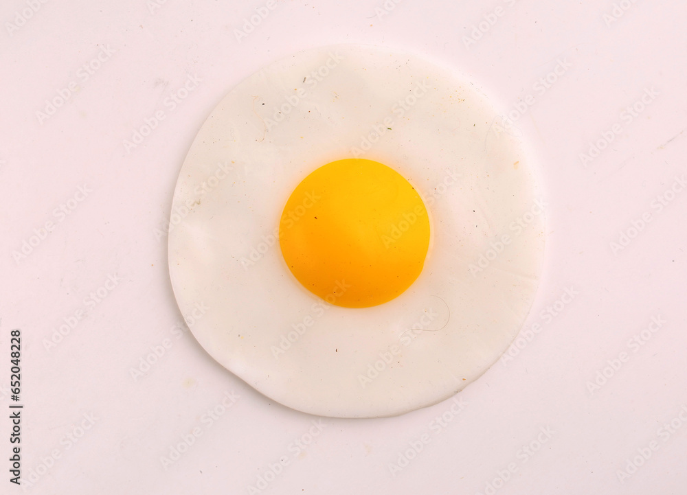 scrambled eggs from a single egg on a gray background scrambled eggs from a single egg on a gray background