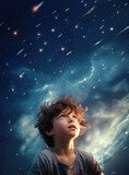 7-year-old boy looking in wonder at the star filled night sky with falling meteors