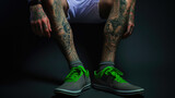 Fashionable Guy with Tattooed Leg and Stylish Sneakers in a Moody Room