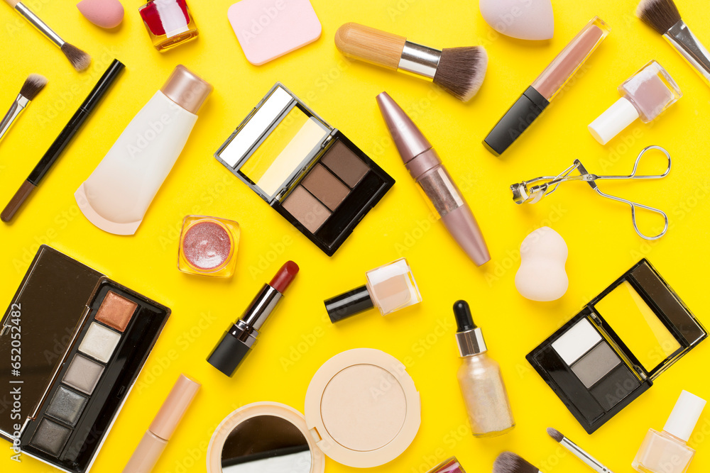 Flat lay with makeup products and tools on color background Flat lay with makeup products and tools on color background