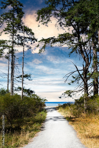 Gravel path leading to the ocean at Rathtrevor Beach on Vancouver Island British Columbia Canada photo