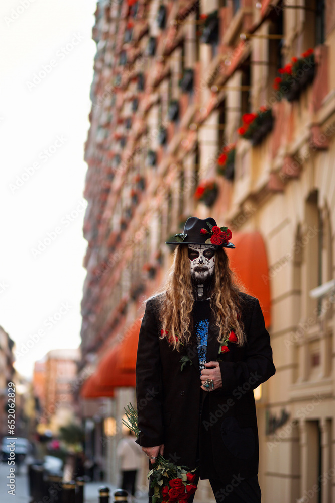 A man walks through the city on Halloween