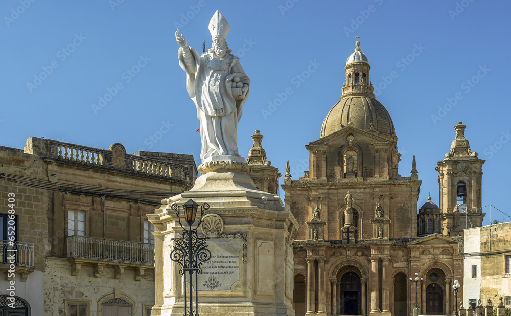Statue of St. Nicholas in front of the Parish Church of San Nicholas, Siggiewi, Malta. Horizontal
