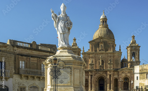 Statue of St. Nicholas in front of the Parish Church of San Nicholas, Siggiewi, Malta. Horizontal