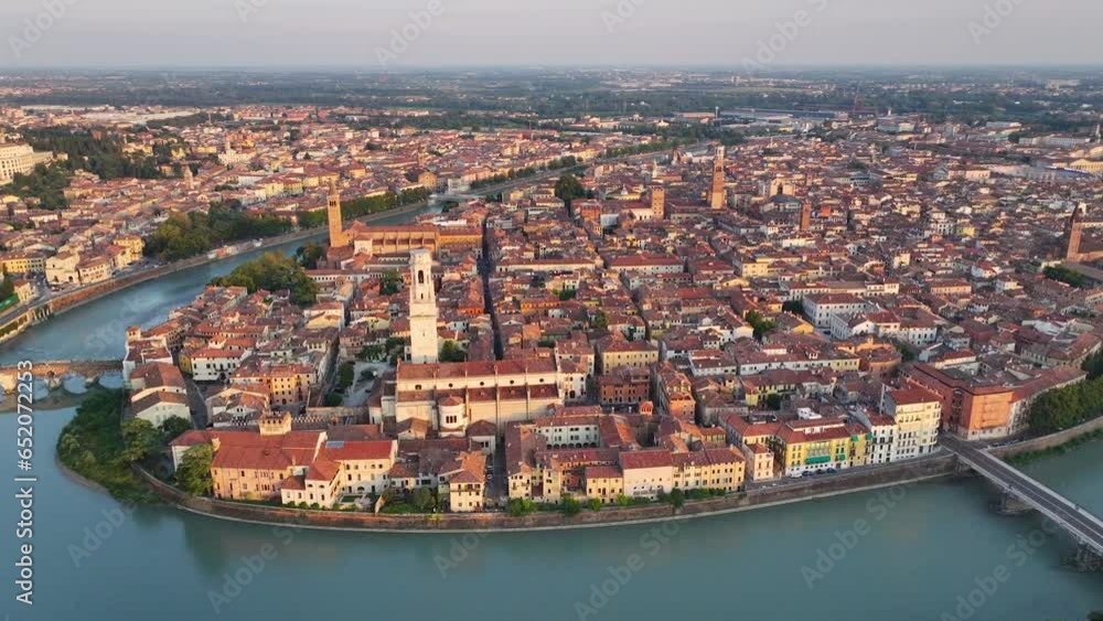 Verona Italy skyline, aerial view of historical city centre, Ponte Pietra bridge across Adige river, Cathedral, Duomo, red tiled roofs, Veneto Region, track in Verona Italy skyline, aerial view of historical city centre, Ponte Pietra bridge across Adige river, Cathedral, Duomo, red tiled roofs, Veneto Region, track in