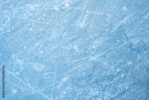 Ice background. Frozen surface of water. Flat view on abstract frozen surface of ice. Textured cold frosty surface of light ice. Background texture of cold blue ice 