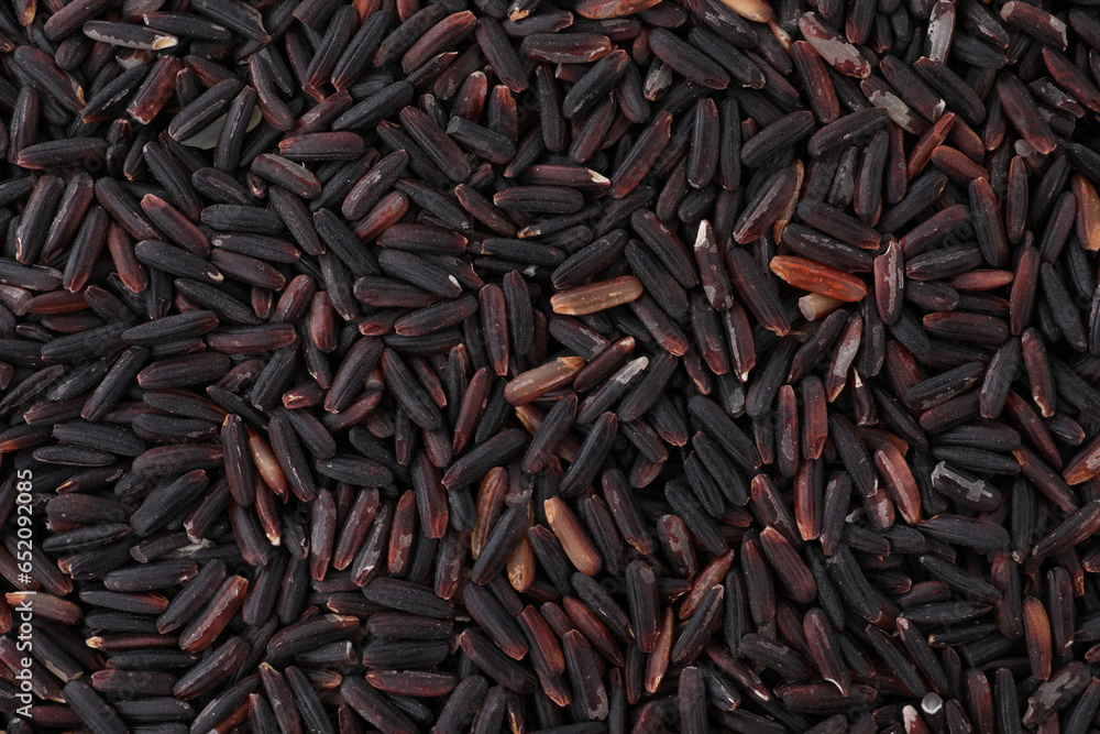 Raw black rice as background, top view Raw black rice as background, top view