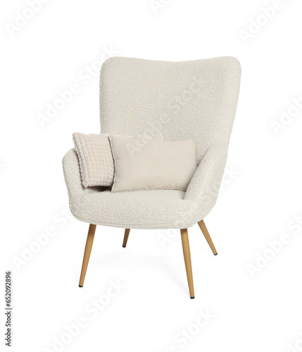 One stylish comfortable armchair with pillows isolated on white