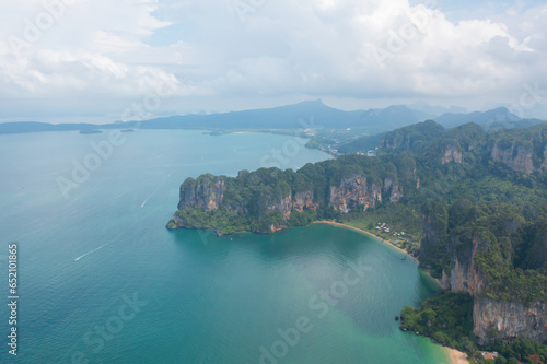 Aerial view of clear blue turquoise seawater, Andaman sea in Phuket island in summer season, Thailand. Water in ocean pattern texture wallpaper background. © tampatra