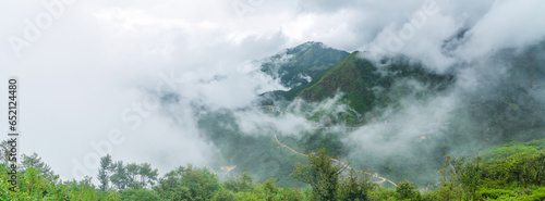 Panoramic view of cloud swirling around a high mountain range near Sapa in Vietnam