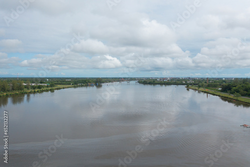 Aerial top view of a garden park with green mangrove forest trees, river, pond or lake. Nature landscape background, Thailand.