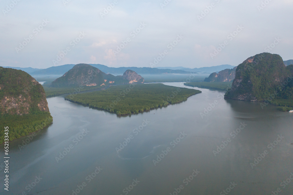 Aerial top view of a garden park with green mangrove forest trees, river, pond or lake. Nature landscape background, Thailand.