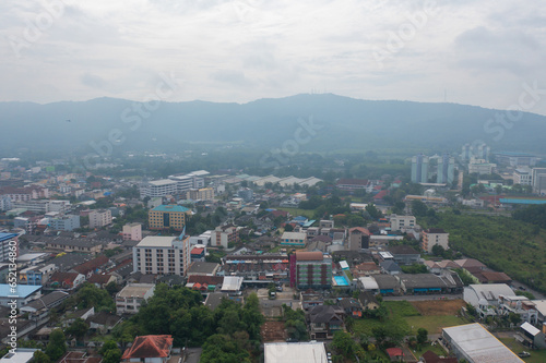 Aerial view of residential neighborhood roofs. Urban housing development from above. Top view. Real estate in Phuket, southern province city, Thailand. Property real estate. photo