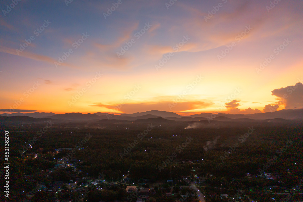 Fototapeta premium Aerial top view of lush green trees from above in tropical forest in national park in summer season. Natural landscape. Pattern texture background.