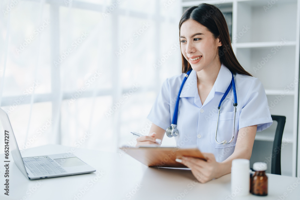 The doctor is checking the patient's history before giving treatment The doctor is checking the patient's history before giving treatment