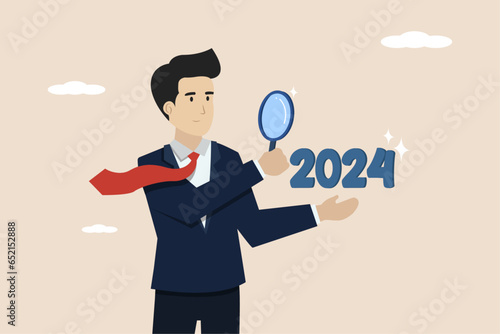 Business prospects for 2024, planning or forecasting, vision of future success, new year achievement targets, smart business people looking with a magnifying glass for 2024 for business prospects.