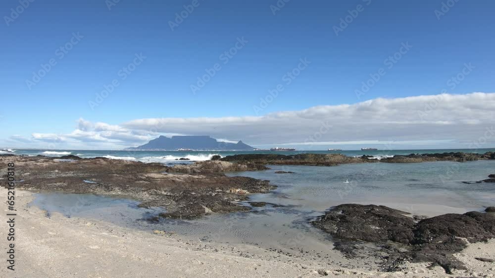 Tidal pool rocky beach with the view of Table Mountain Tidal pool rocky beach with the view of Table Mountain