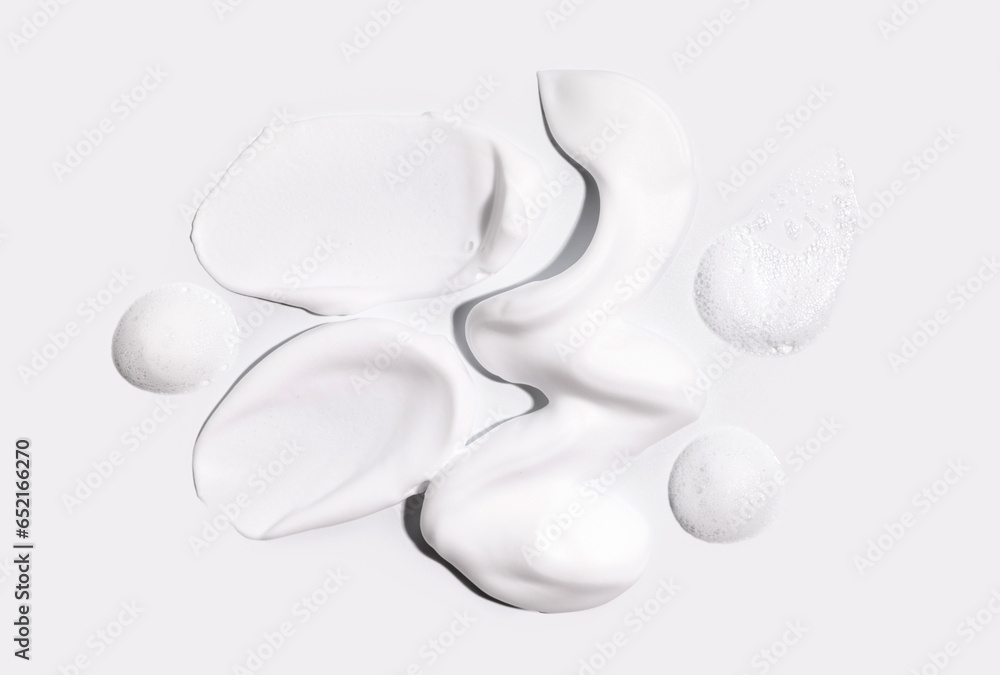 texture foam mousse foam cosmetic smear sample on a light background texture foam mousse foam cosmetic smear sample on a light background