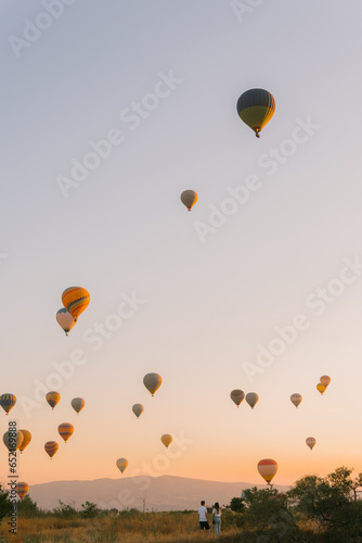 A couple in love against the background of balloons in Cappadocia