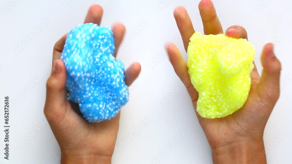 Slime blue and yellow. Foam slime with foam balls Slime blue and yellow. Foam slime with foam balls
