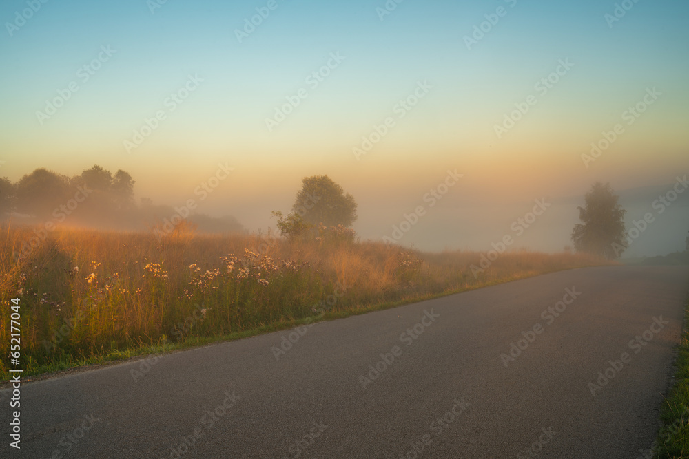 Mountain road on a misty, beautiful morning. Shallow depth of field.Image for CGI Backplates. Mountain road on a misty, beautiful morning. Shallow depth of field.Image for CGI Backplates.